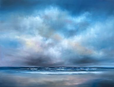A tranquil beach scene under a vast, moody sky with gentle waves.