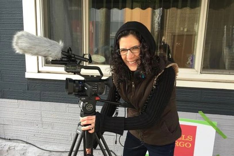 Person operating a video camera