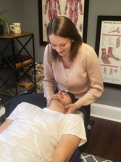 Dr. Sydney providing a tailored adjustment to a Practice Member.