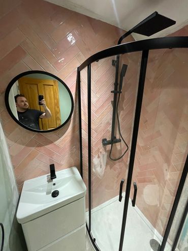 Modern bathroom with herringbone tiles 