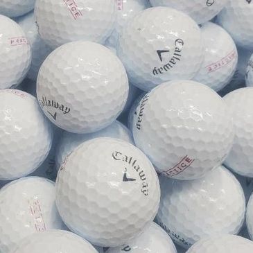 Close-up of multiple white Callaway golf balls clustered together.