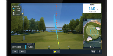 Golf simulator screen showing a shot trajectory and distance information.