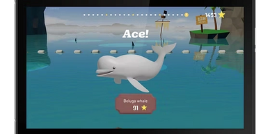 A beluga whale jumps in a colorful game scene with the word 'Ace!' displayed.