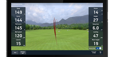 Golf shot trajectory and performance data displayed on a screen.