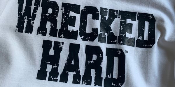 white shirt with wrecked hard printed on it