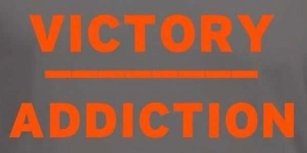 Text saying 'VICTORY ADDICTION' in bright orange.