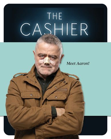 Man with bandaged nose stands confidently under 'The Cashier' sign.