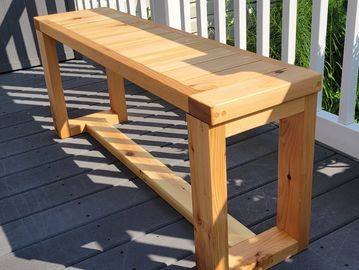 Modern style western cedar garden bench. Measures 43" long by 11" wide by 18" tall. Can be used insi