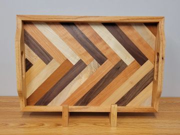 Beautiful serving tray measuring 14X21X2 1/2, made with various hardwoods including black walnut, ma