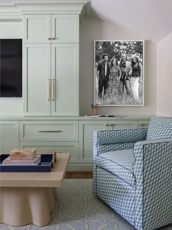 Beautifully designed room featuring a family wall portrait by Elissa Bean Photography