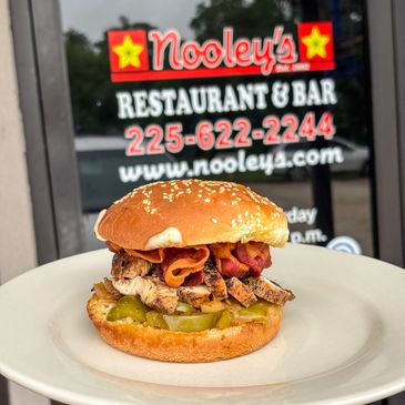 Grilled chicken sandwich with bacon and pickles at Nooley's Restaurant &amp; Bar.