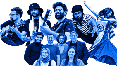 A diverse group of musicians and performers posing together.