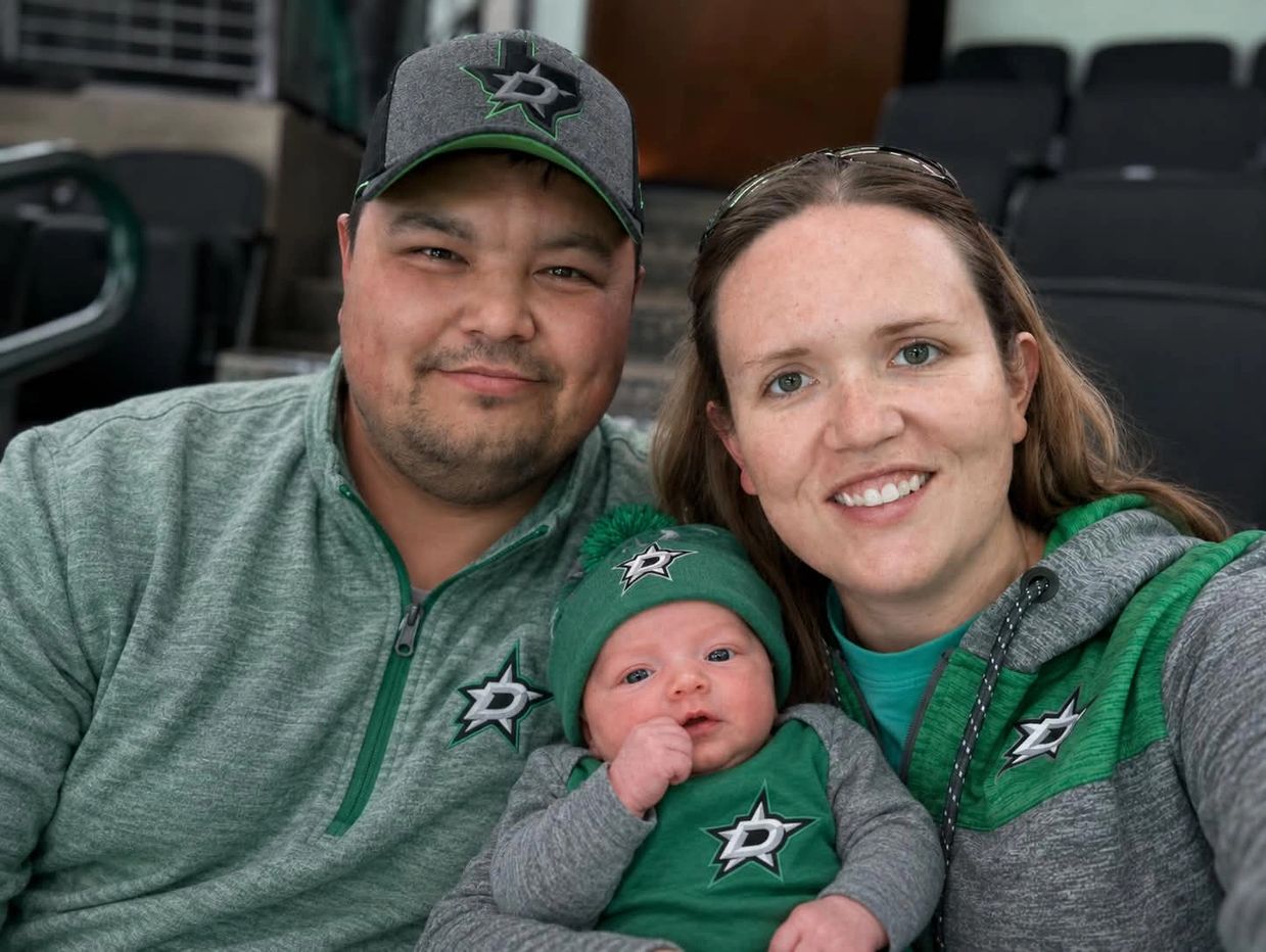 A happy family in matching green sportswear.