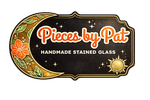 Colorful stained glass crescent moon with floral details and text.