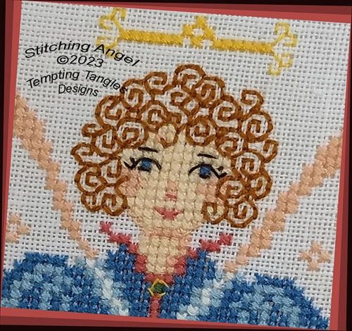 Stitching Angel in cross stitch