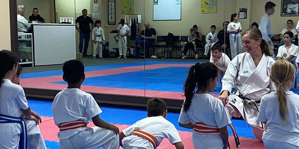 Our 7-11 year karate kids stretching being led by Sensei Lisa
