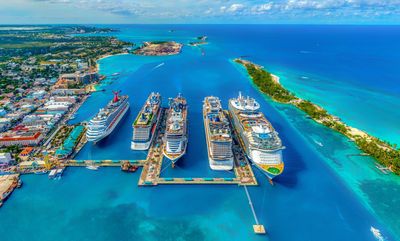 Multiple cruise ships docked in Nassau, Bahamas, showcasing a variety of ocean cruising experiences