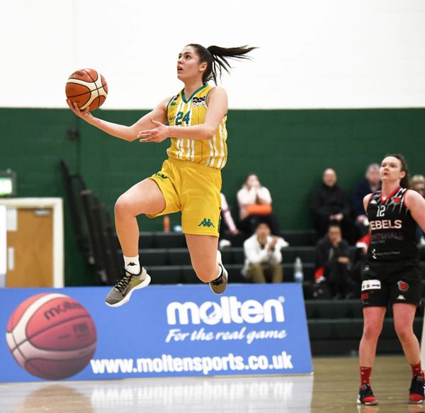 Basketball player flying through the air