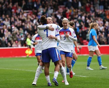 England Women celebrating a goal.