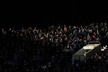 Football crowd photograph showing a shard of light.