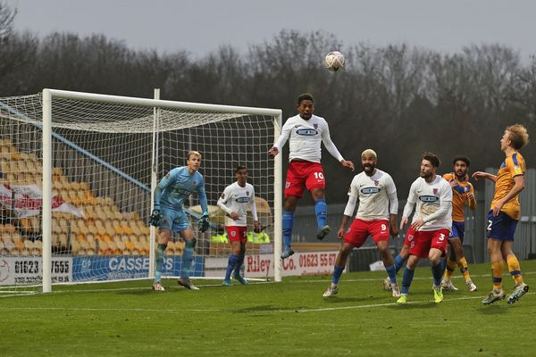 sports photograph of footballers in a goalmouth. 