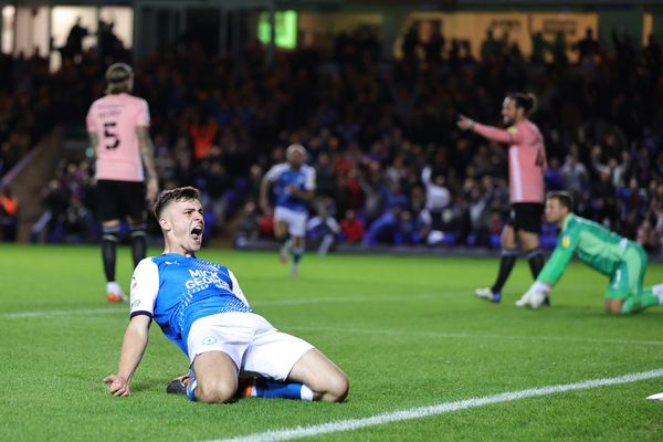 Harrison Burrows of Peterborough United celebrates scoring a goal during a football match.
