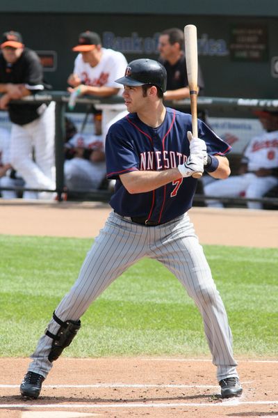 Baseball player from Minnesota Twins ready to bat during a game.