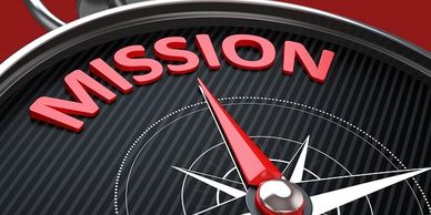 Compass needle pointing at the word 'MISSION' in bold red letters.