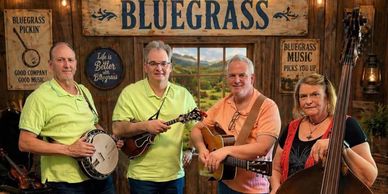 Bluegrass band playing string instruments in a rustic setting.
