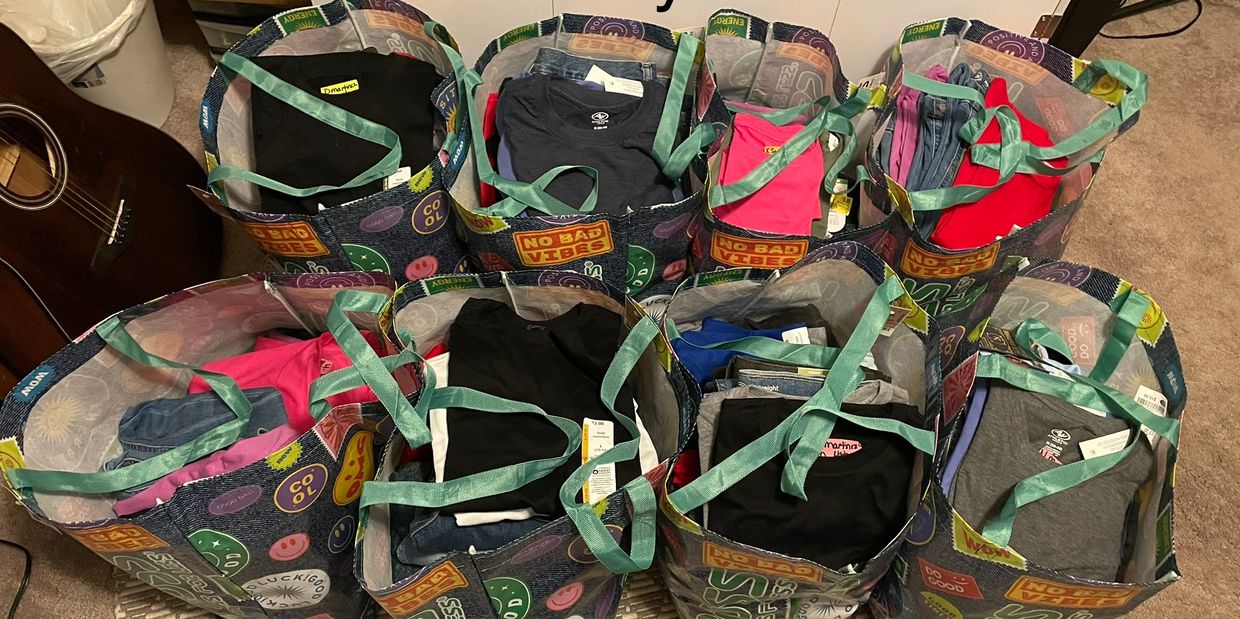Eight bags of 102 uniforms for Cloverleaf School