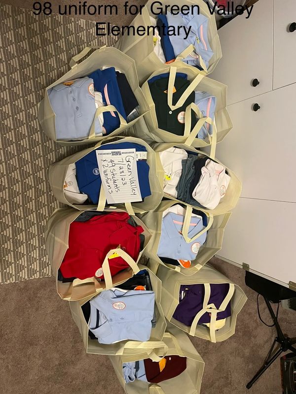 ten bags of 98 uniforms for Green Valley Elementary 