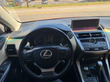 Interior view of a Lexus car dashboard and steering wheel.