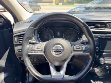 Steering wheel of a Nissan car.