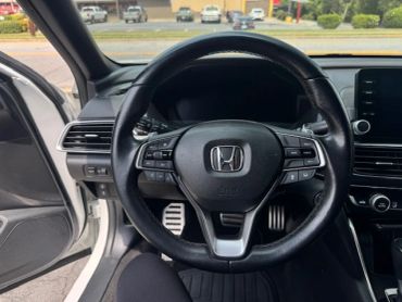 Steering wheel inside a Honda car.