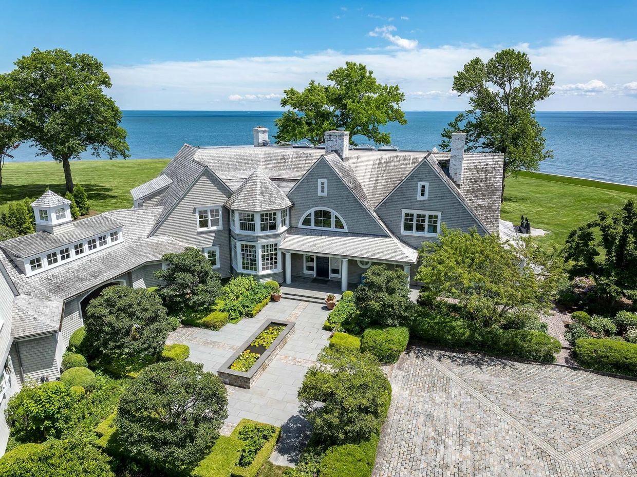 Westchester County waterfront estate on Long Island Sound with manicured tall fescue lawn, formal en