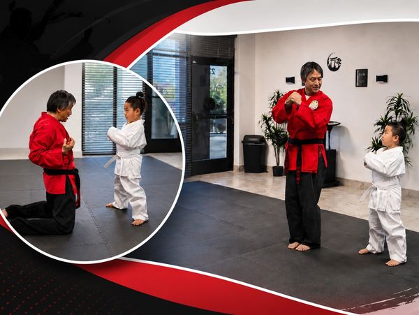 Martial arts training between an instructor and a child.