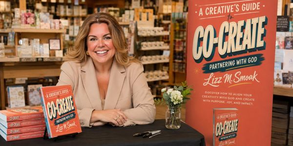 Woman promoting her book "Co-Create" at a bookstore.