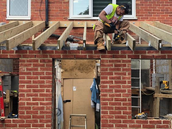 the builder is building the roof
