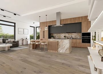 Modern kitchen and living space with wood and marble accents.