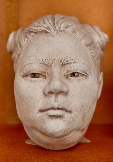 "Gen Zee".  Portrait in Terracotta with faux marble finish. 
Artist: Dana McCullough