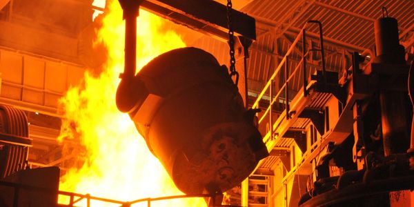 Ladle of molten steel ready to pour into electric arc furnace.