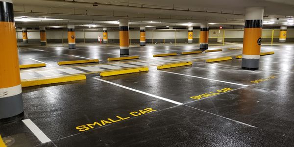stripe line painting in an underground parking. 
 
Parking Lot Line Striping And Parking Lot Layout