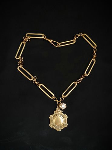 Antique brass shield fob & handmade lucky horseshoe charm on brass chain.
Available on Etsy 