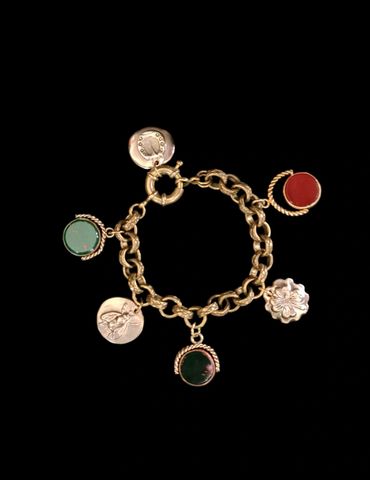 Charm bracelet with contemporary handmade charms mixed with antique watch fob spinner charms 