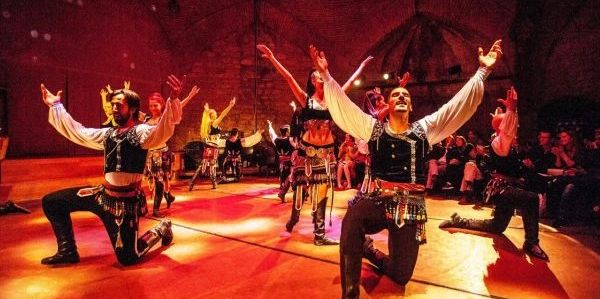 A cozy cave restaurant bathed in warm. light, authentic folk dance and captivating belly dance,