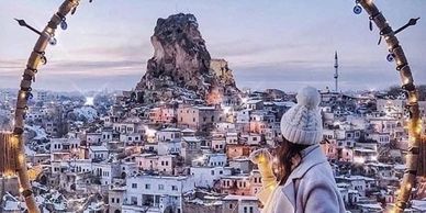 Ortahisar Castle in Cappadocia with panoramic views, carved rock tower, and ancient stone paths