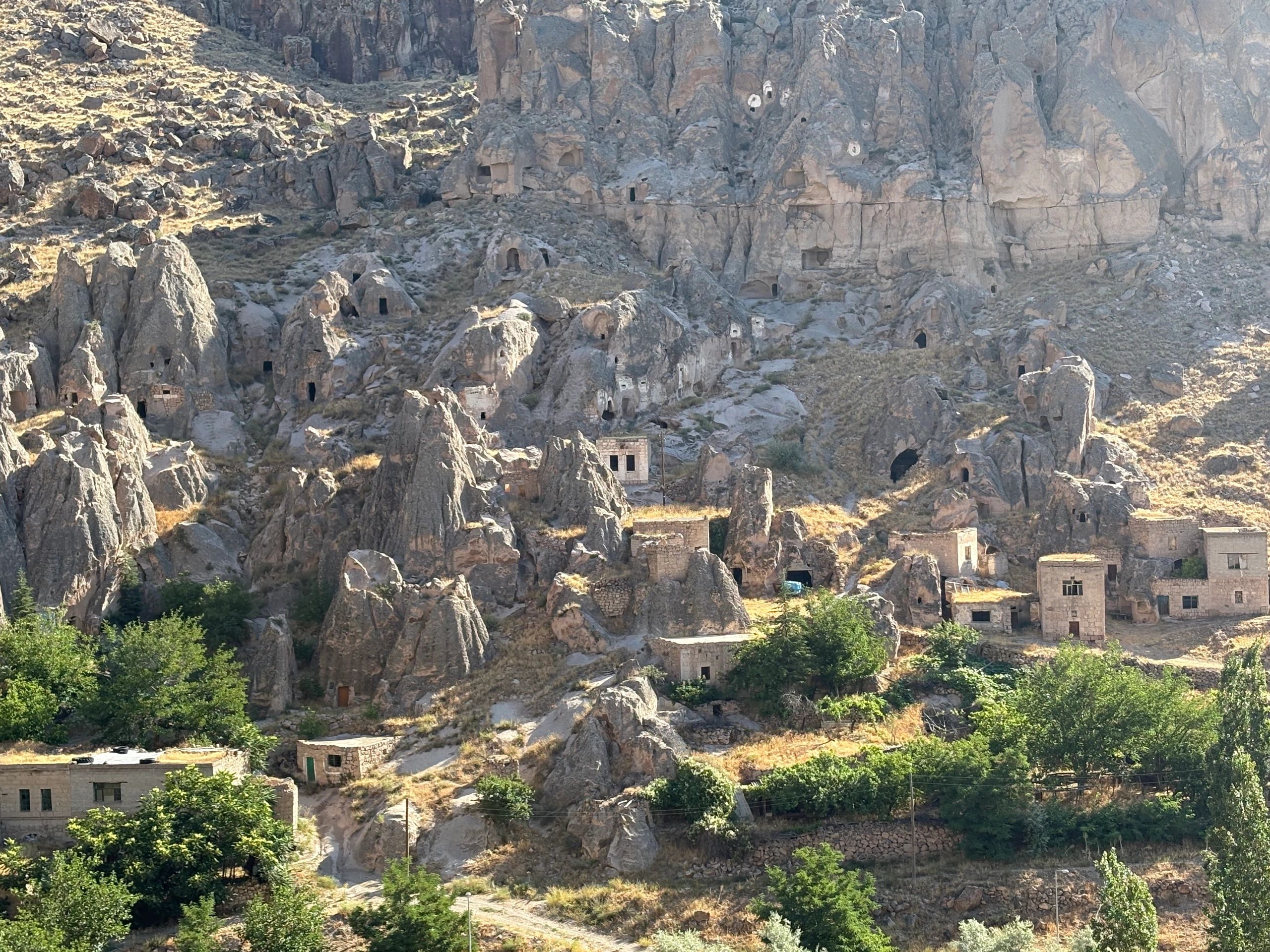 East Cappadocia cave village with fairy chimneys — photo stop on our Sunrise Silk Road Jeep Tour.”
