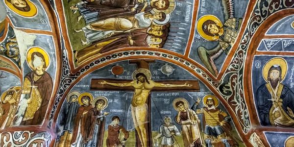 Byzantine-style fresco depicting the crucifixion of Jesus with saints and angels.