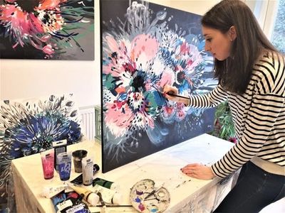 Judy Century painting in her studio