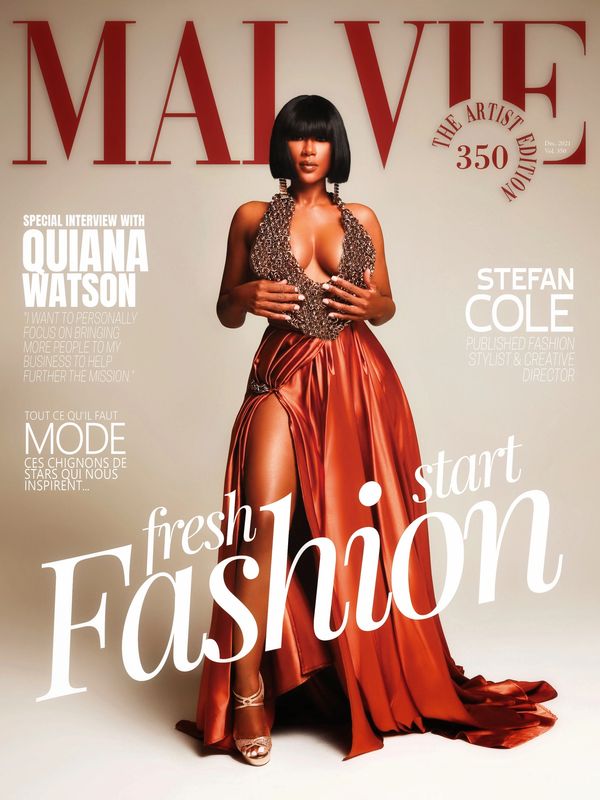 Fashion model in a striking brown and gold gown on MALVIE magazine cover.